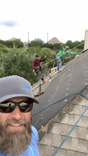 A group of men maintaining the roof
