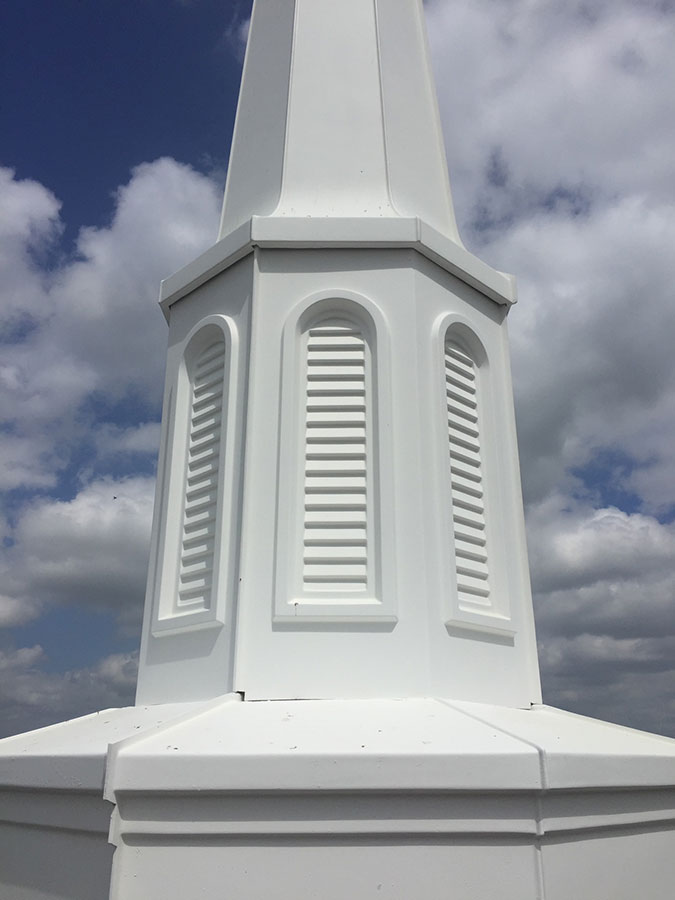 The base of the church tower coated in white