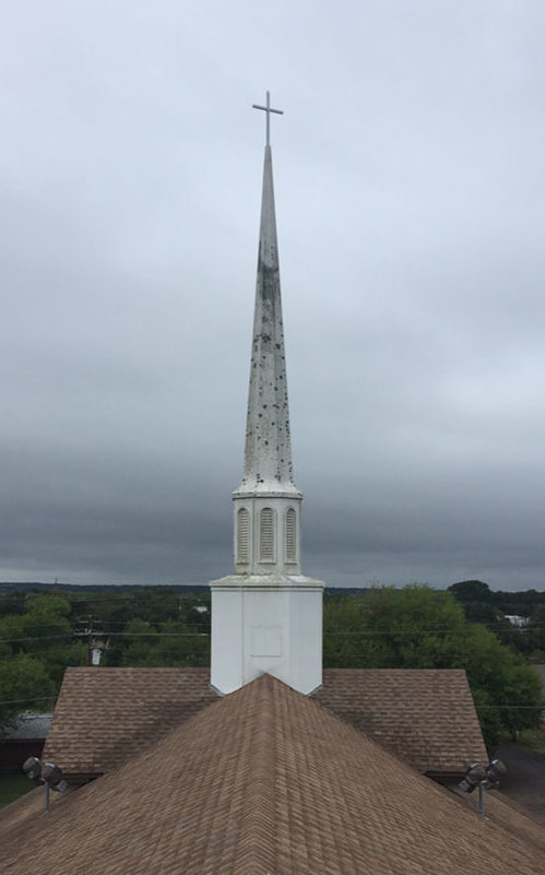 A church tower worn down