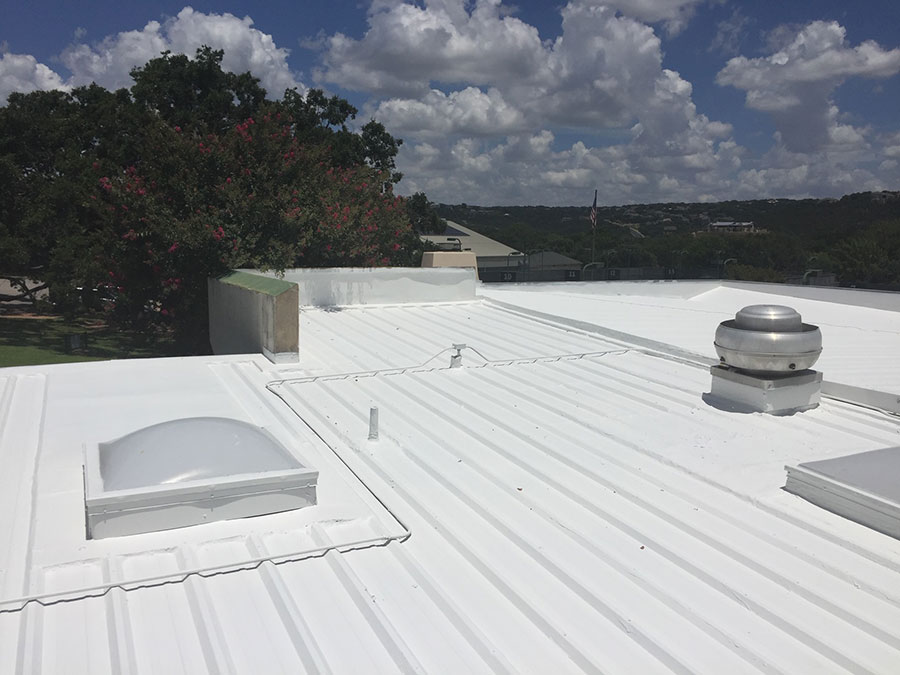 A newly coated white metal roof