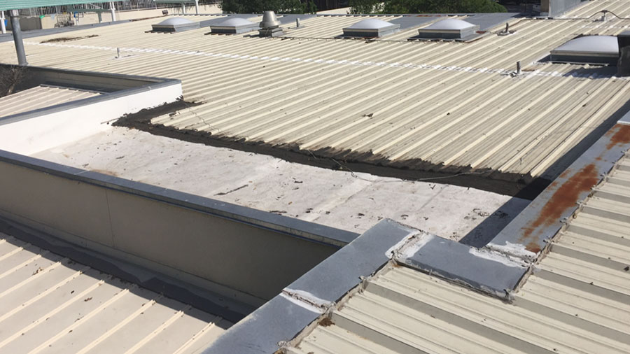 A metal roof with rust and seals