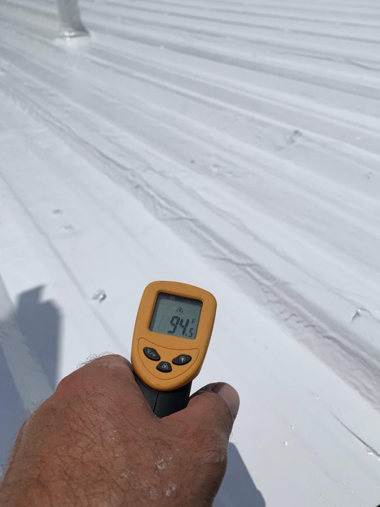 A device checking the roof’s temperature after coating
