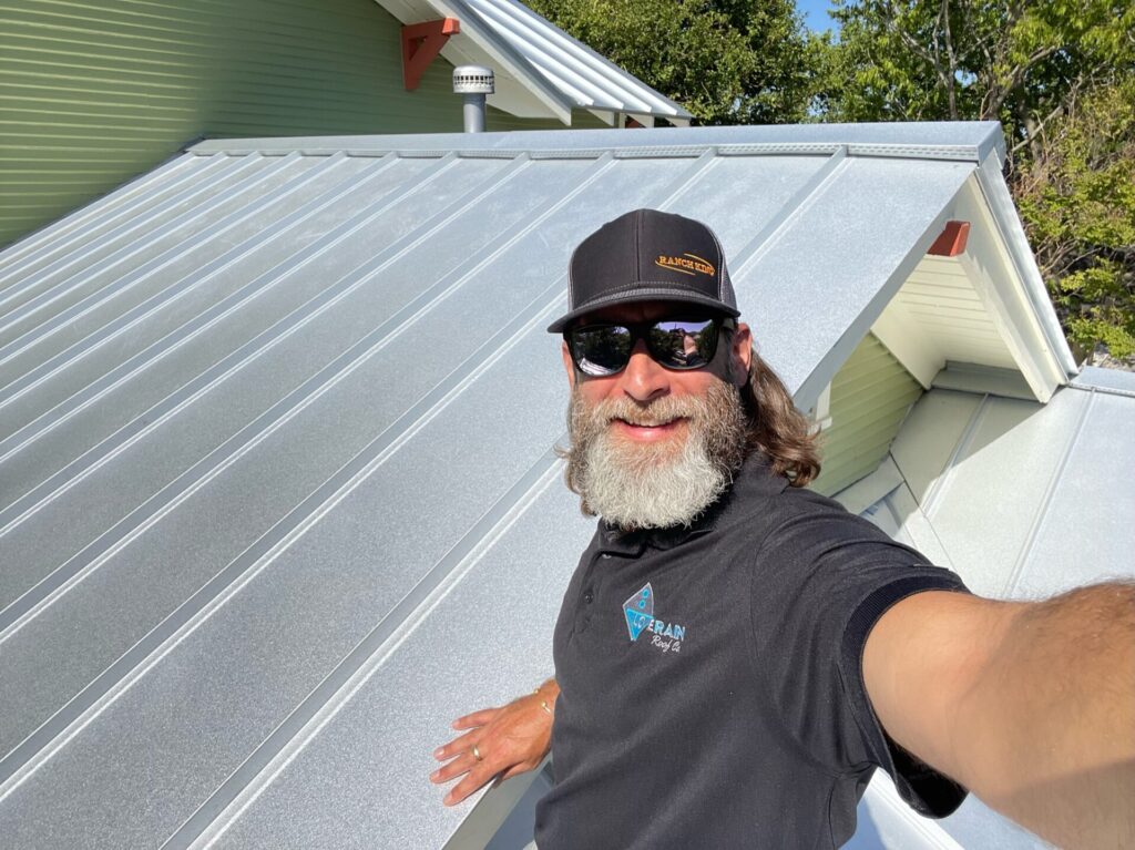 A man on a metal roof